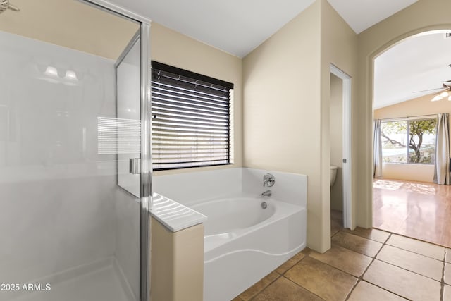 bathroom with separate shower and tub, tile patterned floors, ceiling fan, and toilet