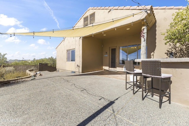 back of house featuring a patio
