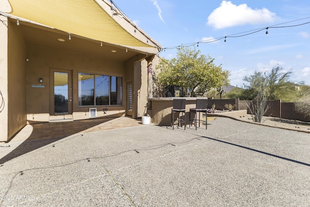 view of patio featuring a bar