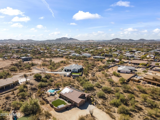 birds eye view of property with a mountain view