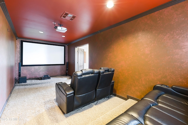 home theater room featuring crown molding and carpet