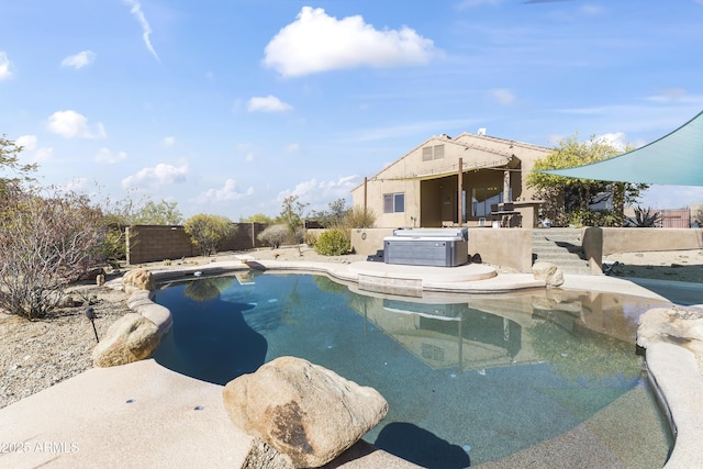view of pool featuring a hot tub