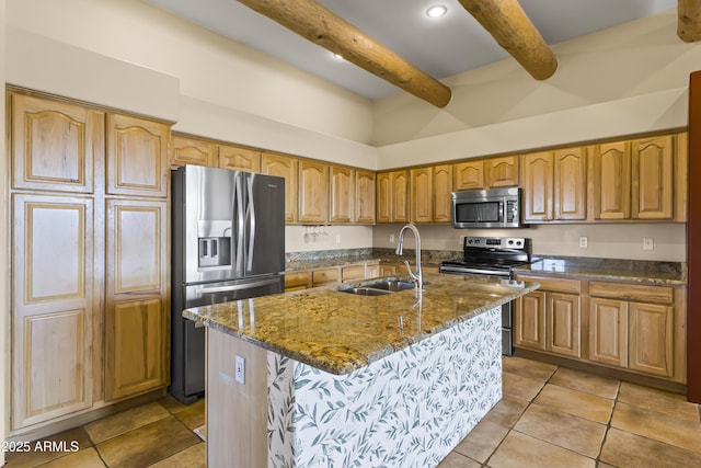 kitchen featuring stainless steel appliances, sink, a center island with sink, and light tile patterned floors