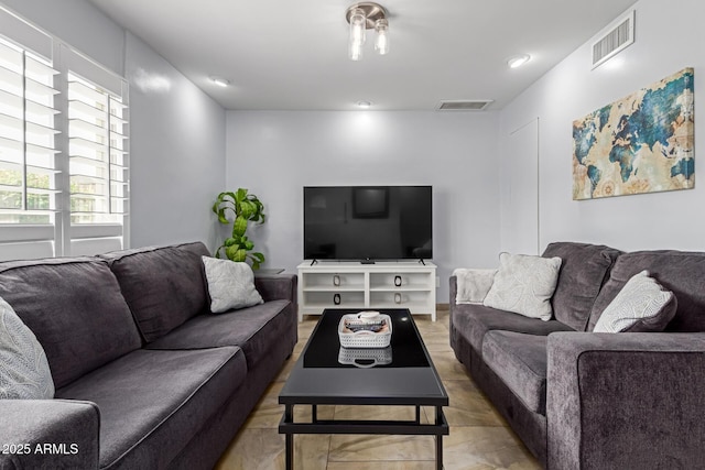 living area featuring visible vents