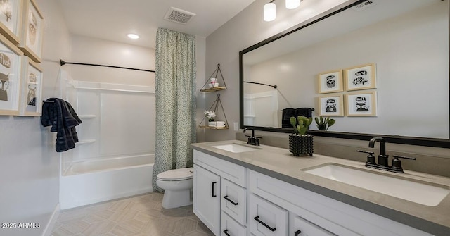 full bathroom featuring toilet, vanity, and shower / bath combo with shower curtain