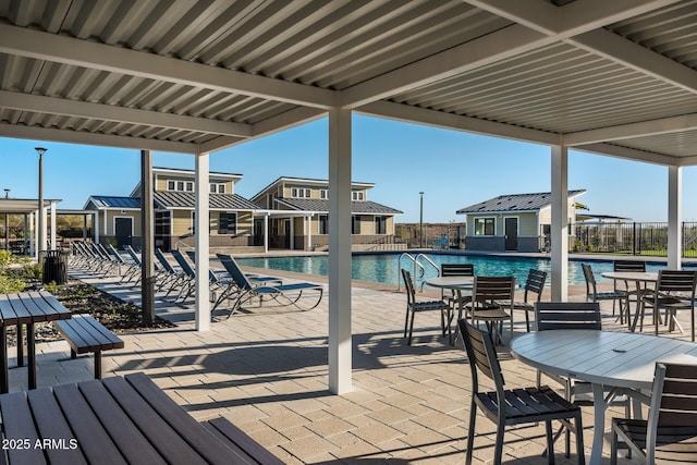 view of swimming pool with an outbuilding and a patio area