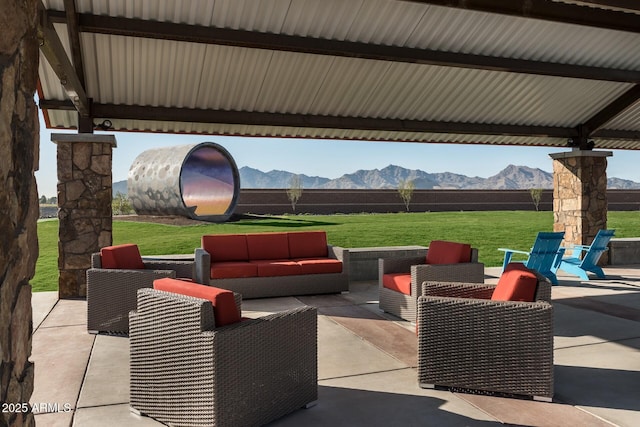 view of patio / terrace with a mountain view and an outdoor hangout area