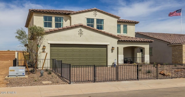 mediterranean / spanish-style house with a garage