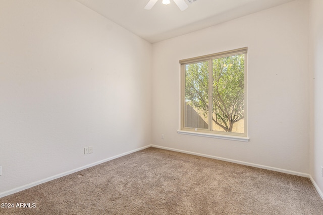 carpeted empty room with ceiling fan