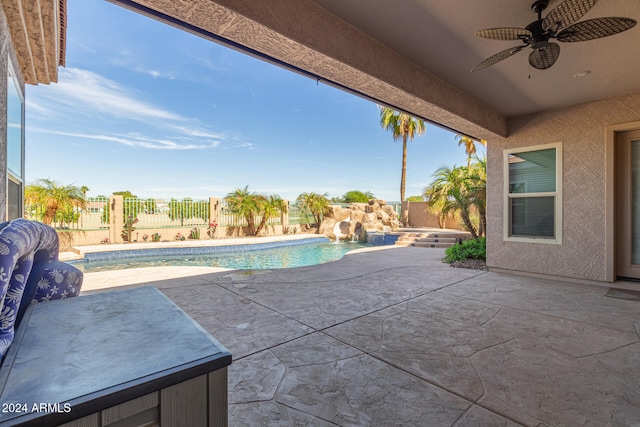 view of swimming pool featuring a jacuzzi, a patio area, and ceiling fan