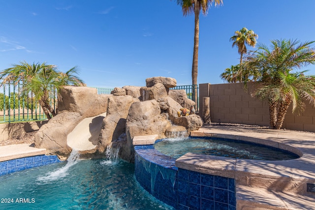 view of pool featuring pool water feature