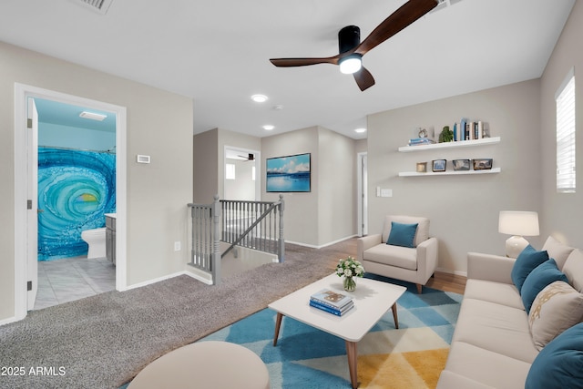 living room featuring carpet flooring, recessed lighting, baseboards, and ceiling fan