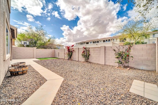 view of yard featuring a fenced backyard