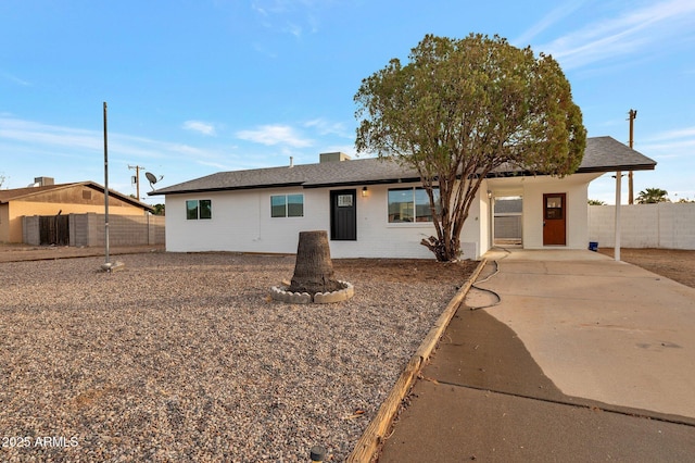 single story home with a carport