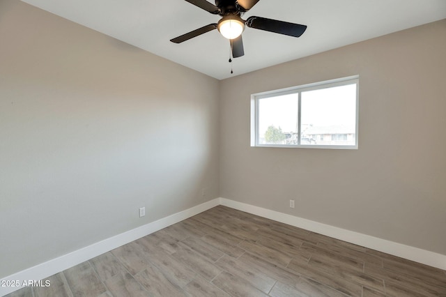 spare room featuring ceiling fan and light wood-type flooring