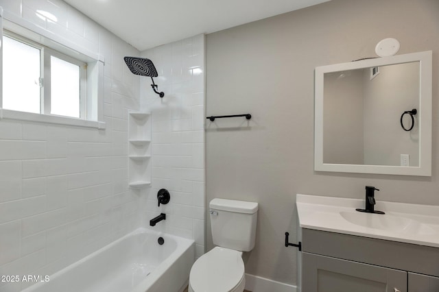 full bathroom with tiled shower / bath combo, vanity, and toilet