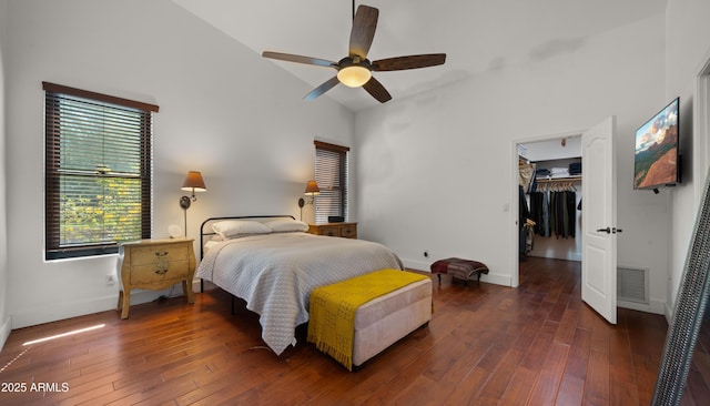 2311 W Dobbins Rd, Phoenix, AZ 85041 - bedroom with baseboards, multiple windows, hardwood / wood-style floors, and lofted ceiling