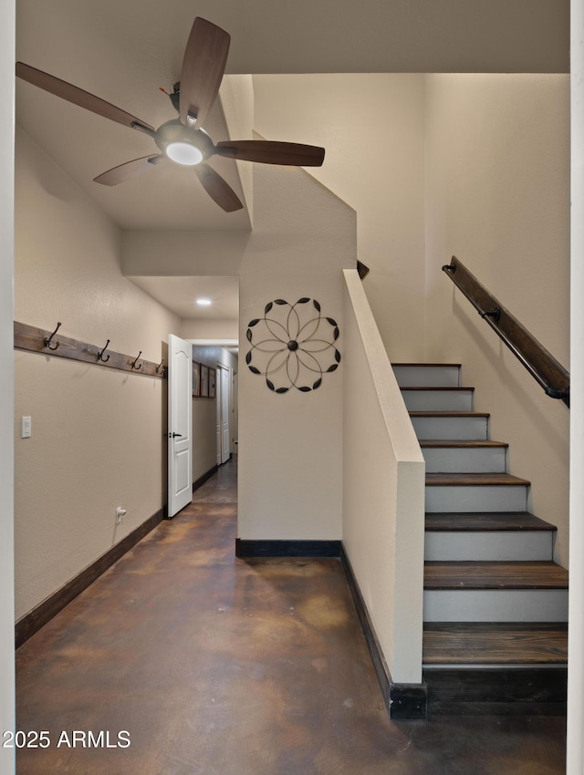 2311 W Dobbins Rd, Phoenix, AZ 85041 - staircase with ceiling fan, finished concrete flooring, and baseboards