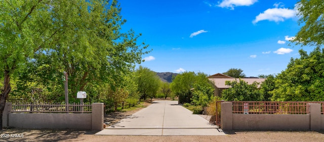 2311 W Dobbins Rd, Phoenix, AZ 85041 - view of community featuring a fenced front yard, a mountain view, and a gate