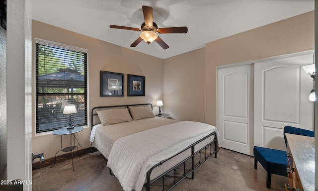 2311 W Dobbins Rd, Phoenix, AZ 85041 - bedroom featuring unfinished concrete floors, ceiling fan, and a closet