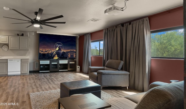 2311 W Dobbins Rd, Phoenix, AZ 85041 - living room with a ceiling fan and light wood-style flooring