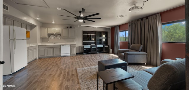2311 W Dobbins Rd, Phoenix, AZ 85041 - living area featuring ceiling fan and wood finished floors