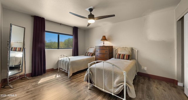 2311 W Dobbins Rd, Phoenix, AZ 85041 - bedroom featuring baseboards, wood finished floors, and a ceiling fan