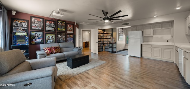 2311 W Dobbins Rd, Phoenix, AZ 85041 - living room with ceiling fan, light wood-style flooring, and recessed lighting