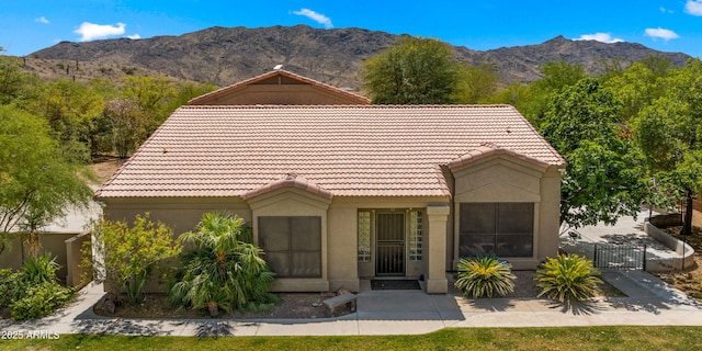 2311 W Dobbins Rd, Phoenix, AZ 85041 - view of front of property featuring a tile roof, a gate, stucco siding, and a mountain view