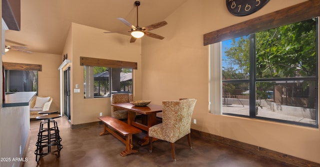 2311 W Dobbins Rd, Phoenix, AZ 85041 - dining area with ceiling fan, concrete floors, baseboards, and vaulted ceiling