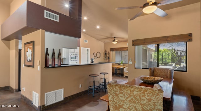 2311 W Dobbins Rd, Phoenix, AZ 85041 - dining room featuring ceiling fan, high vaulted ceiling, finished concrete flooring, baseboards, and recessed lighting
