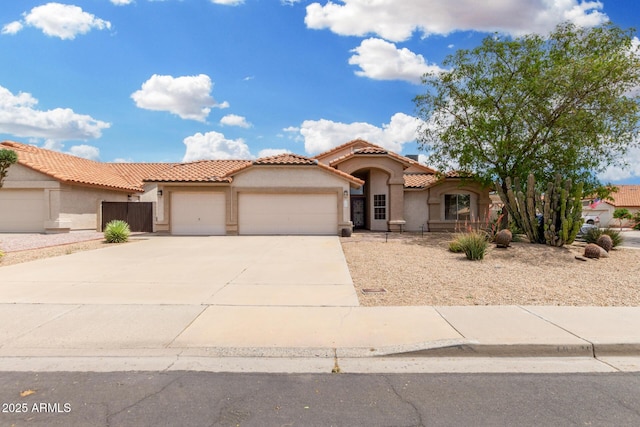 19029 N 36th St, Phoenix, AZ 85050 - mediterranean / spanish home with a garage, stucco siding, concrete driveway, and a tile roof