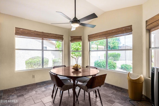 19029 N 36th St, Phoenix, AZ 85050 - dining space with stone finish floors, baseboards, a ceiling fan, and vaulted ceiling