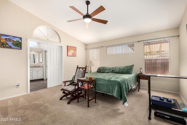 19029 N 36th St, Phoenix, AZ 85050 - carpeted bedroom with lofted ceiling, connected bathroom, a sink, baseboards, and ceiling fan