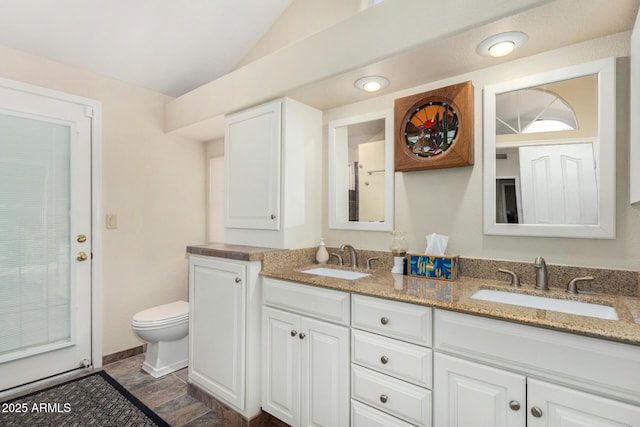 19029 N 36th St, Phoenix, AZ 85050 - bathroom with lofted ceiling, double vanity, and toilet