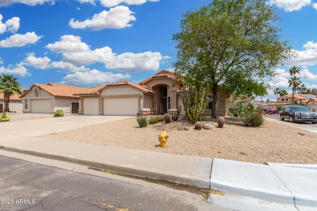 19029 N 36th St, Phoenix, AZ 85050 - mediterranean / spanish-style home featuring a garage, stucco siding, a tiled roof, and concrete driveway