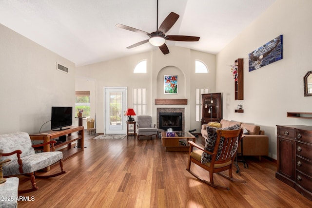 19029 N 36th St, Phoenix, AZ 85050 - living area featuring wood finished floors, ceiling fan, a fireplace, and high vaulted ceiling