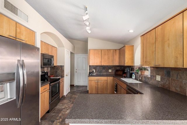 19029 N 36th St, Phoenix, AZ 85050 - kitchen with stainless steel appliances, a sink, dark countertops, decorative backsplash, and a peninsula