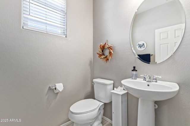 bathroom featuring toilet