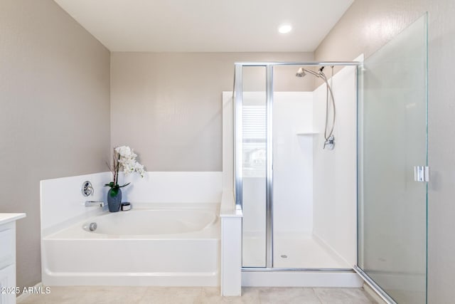 bathroom with vanity, tile patterned flooring, and independent shower and bath