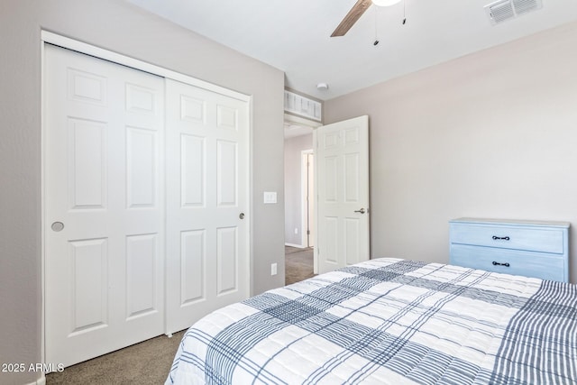 carpeted bedroom with a closet and ceiling fan