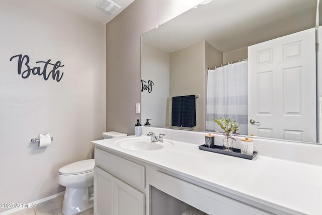 bathroom with vanity and toilet