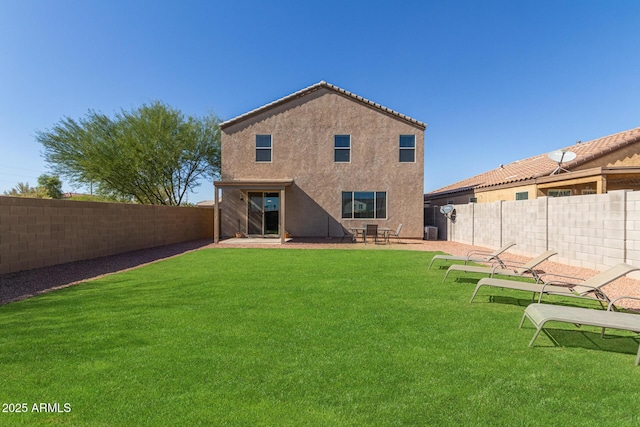 back of house featuring a yard and central air condition unit