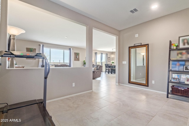 workout room with light tile patterned floors