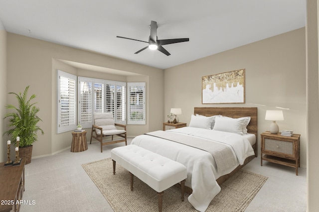 17882 N Painted Spurge Ct, Surprise, AZ 85374 - bedroom with light carpet, ceiling fan, and baseboards
