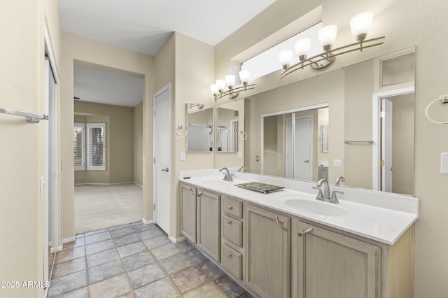 17882 N Painted Spurge Ct, Surprise, AZ 85374 - full bath with double vanity, baseboards, and a sink