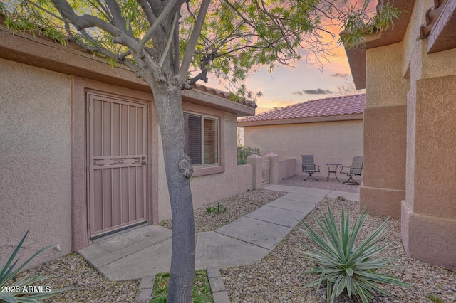 17882 N Painted Spurge Ct, Surprise, AZ 85374 - exterior space with a tiled roof, a patio area, and stucco siding