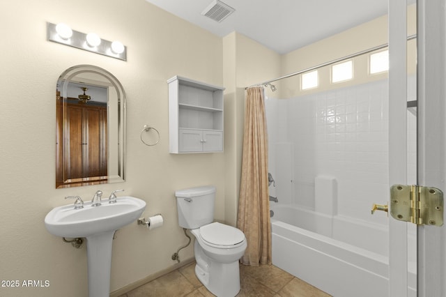 17882 N Painted Spurge Ct, Surprise, AZ 85374 - full bathroom with shower / tub combo with curtain, visible vents, toilet, a sink, and tile patterned floors