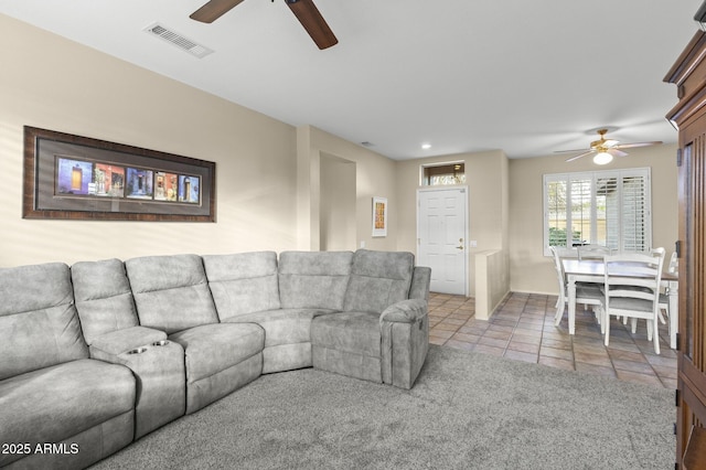 17882 N Painted Spurge Ct, Surprise, AZ 85374 - living area with light tile patterned floors, baseboards, visible vents, and a ceiling fan