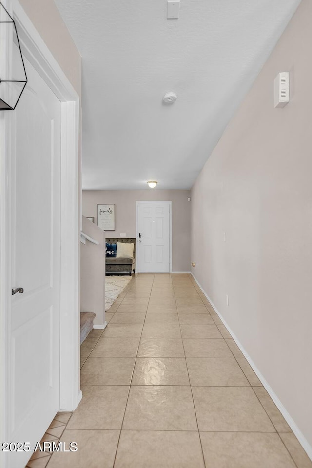 2198 W Pima Ave, Coolidge, AZ 85128 - hallway featuring light tile patterned flooring and stairs
